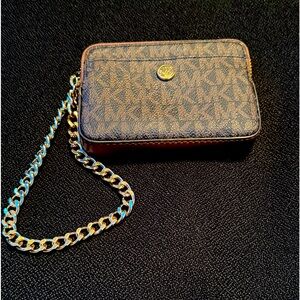 Michael Kors wrist wallet, brand new never been used.